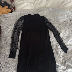 Elegant Black Dress with Sheer Polka Dot Sleeves